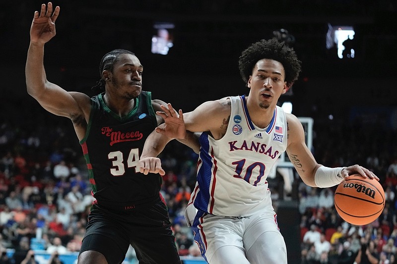 Kansas's Jalen Wilson tries to get past Howard's Bryce Harris during the first half of a first-round college basketball game in the NCAA Tournament Thursday, March 16, 2023, in Des Moines, Iowa. (AP Photo/Morry Gash)