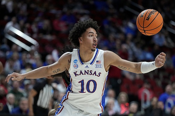 Kansas forward Jalen Wilson (10) grabs a rebound in the first half of a first-round college basketball game against Howard in the NCAA Tournament, Thursday, March 16, 2023, in Des Moines, Iowa. (AP Photo/Charlie Neibergall)
