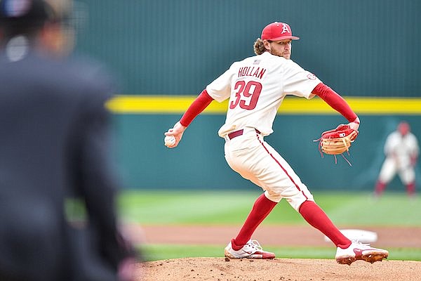 Arkansas starting pitcher Hunter Hollan (39) delivers to the plate, Sunday, March 12, 2023, during the first inning between the Razorbacks and the Louisiana Tech Bulldogs at Baum-Walker Stadium in Fayetteville.