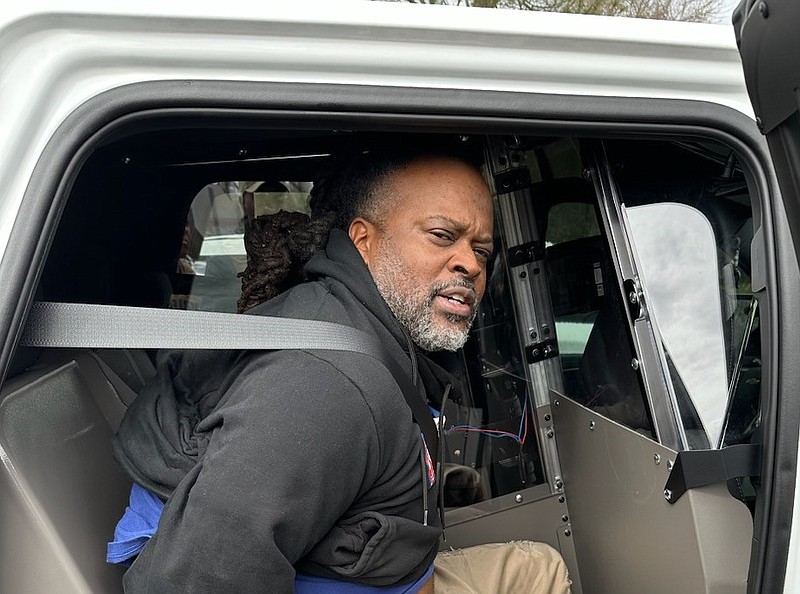 Dedric Broyles sits in a law enforcement vehicle after authorities said he led multiple agencies on a chase through Pine Bluff on Thursday. (Special to The Commercial/Jefferson County Sheriff's Office)