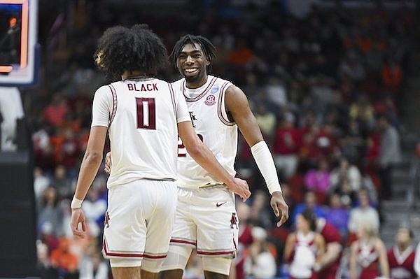 Arkansas forward Kamani Johnson (20) reacts, Thursday, March 16, 2023, during the first half of the NCAA Tournament first-round game against Illinois at Wells Fargo Arena in Des Moines, Iowa.