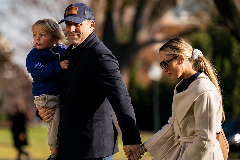 Hunter Biden walks on the South Lawn of the White House with son Beau Biden Jr. and wife Melissa Cohen in December.
(The Washington Post/Al Drago)