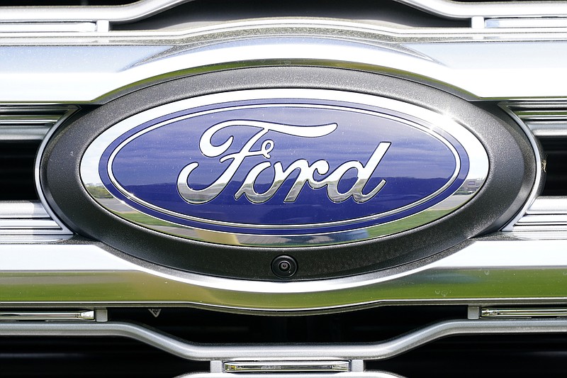 FILE - A logo on a vehicle at a Ford dealership in Springfield, Pa., Tuesday, April 26, 2022. (AP Photo/Matt Rourke, File)