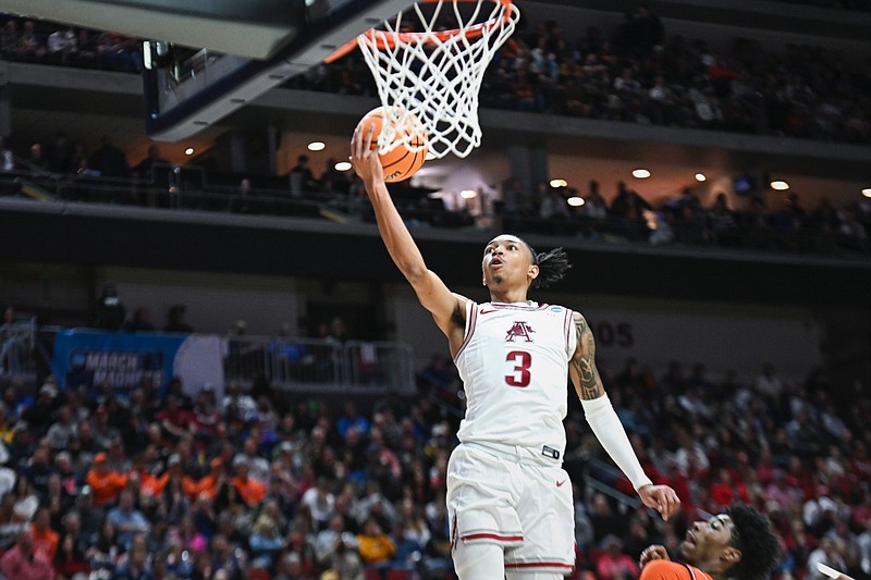 Arkansas guard Nick Smith Jr. (3) shoots, Thursday, March 16, 2023 during the first half of the NCAA Division I Basketball Championship First Round game at the Wells Fargo Arena in Des Moines, Iowa. Visit nwaonline.com/photos for the photo gallery.