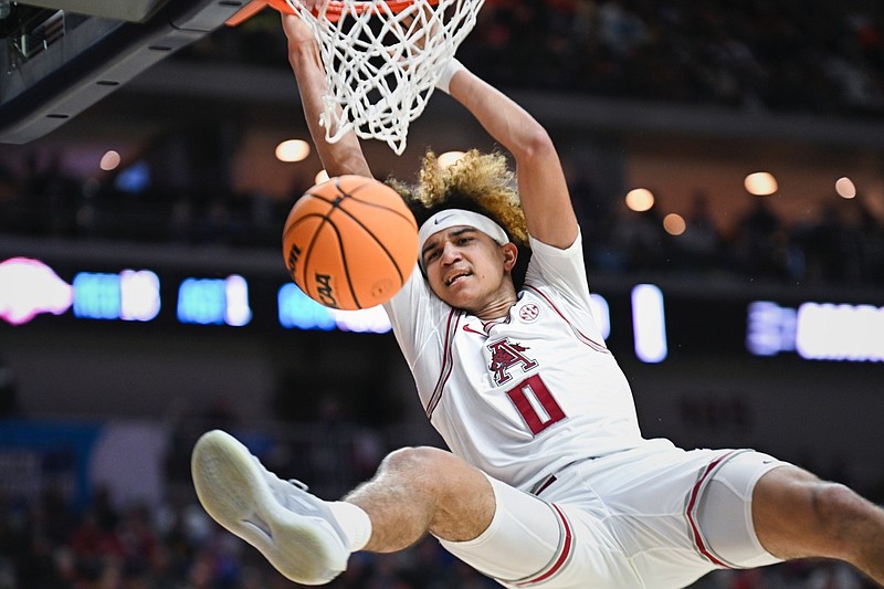 Arkansas guard Anthony Black (0) dunks, Thursday, March 16, 2023 during the first half of the NCAA Division I Basketball Championship First Round game at the Wells Fargo Arena in Des Moines, Iowa. Visit nwaonline.com/photos for the photo gallery.