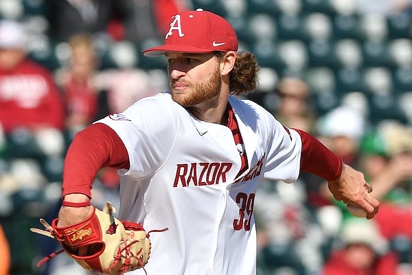 Arkansas starter Hunter Hollan delivers a pitch Friday, March 17, 2023, during the first inning of the Razorbacks’ 7-2 win over Auburn at Baum-Walker Stadium in Fayetteville.