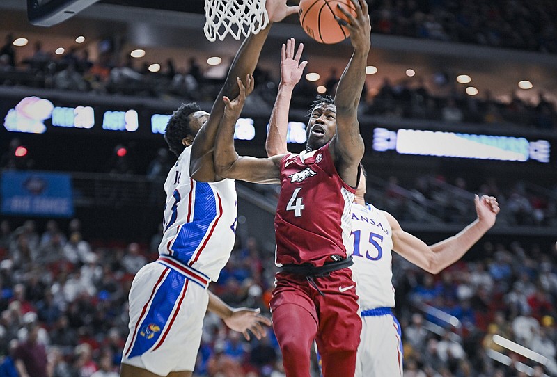 Arkansas guard Davonte Davis (4) shoots during the second half in an NCAA Men’s Tournament second-round game Saturday at the Wells Fargo Arena in Des Moines, Iowa. Davis led the Razorbacks with 25 points. More photos at arkansasonline.com/319uaku/
(NWA Democrat-Gazette/Charlie Kaijo)