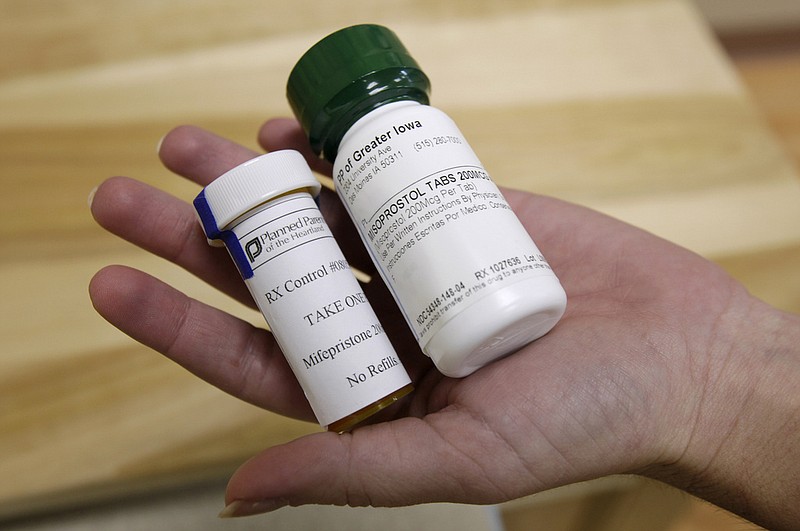 Bottles of abortion pills mifepristone (left) and misoprostol (right) are shown at a clinic in Des Moines, Iowa, in this Sept. 22, 2010 file photo. Medication abortions were the preferred method for ending pregnancy in the U.S. even before the Supreme Court overturned Roe v. Wade. (AP/Charlie Neibergall)