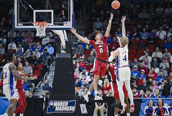 Arkansas guard Anthony Black (0) defends a shot by Kansas guard Gradey Dick during an NCAA Tournament game Saturday, March 18, 2023, in Des Moines, Iowa.
