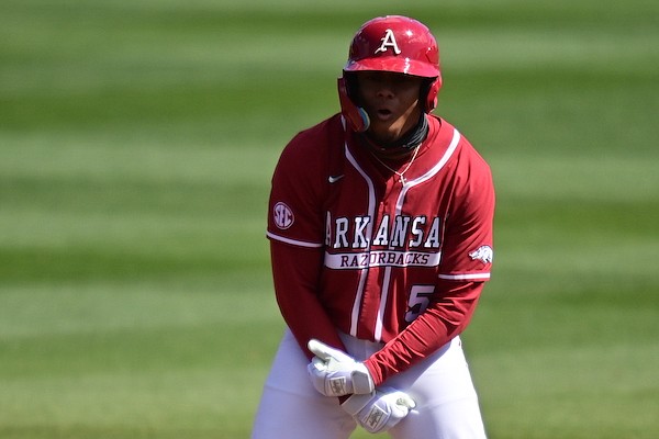 Arkansas designated hitter Kendall Diggs celebrates a hit during a game against Auburn on Saturday, March 18, 2023, in Fayetteville.