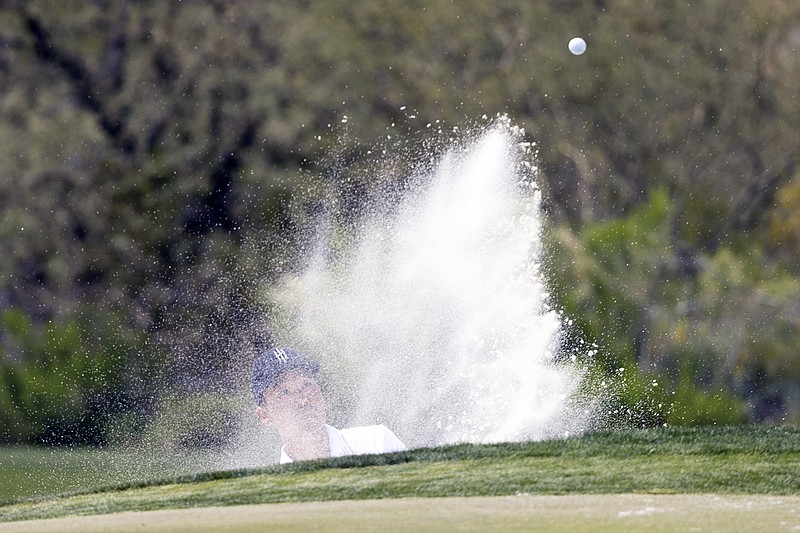 Kevin Na hits out of the bunker on the 10th hole during Saturday's second round of the LIV Golf event in Tucson, Ariz. (LIV Golf via the Associated Press)