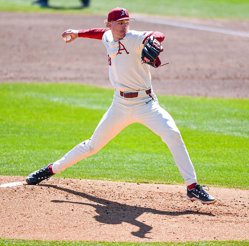 Arkansas starting pitcher Cody Adcock (49) delivers to the plate, Sunday, March 19, 2023, during the third inning of the Razorbacks’ 5-0 win over the Auburn Tigers at Baum-Walker Stadium in Fayetteville. Visit nwaonline.com/photo for today's photo gallery..(NWA Democrat-Gazette/Hank Layton)