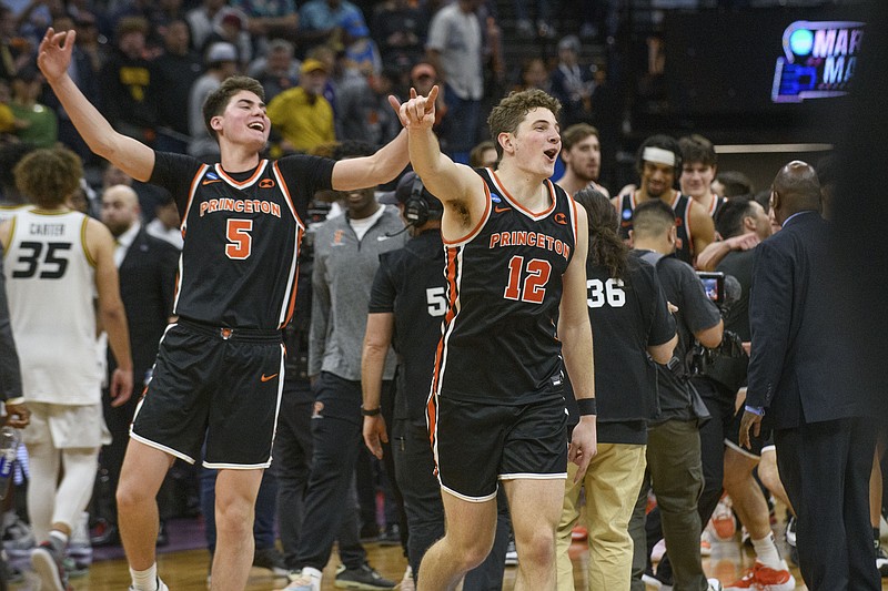 Princeton guard Ryan Langborg (3) and forward Caden Pierce (12) celebrate the team's win in a second-round college basketball game against Missouri in the men's NCAA Tournament in Sacramento, Calif., Saturday, March 18, 2023. Princeton won 78-63. (AP Photo/Randall Benton)