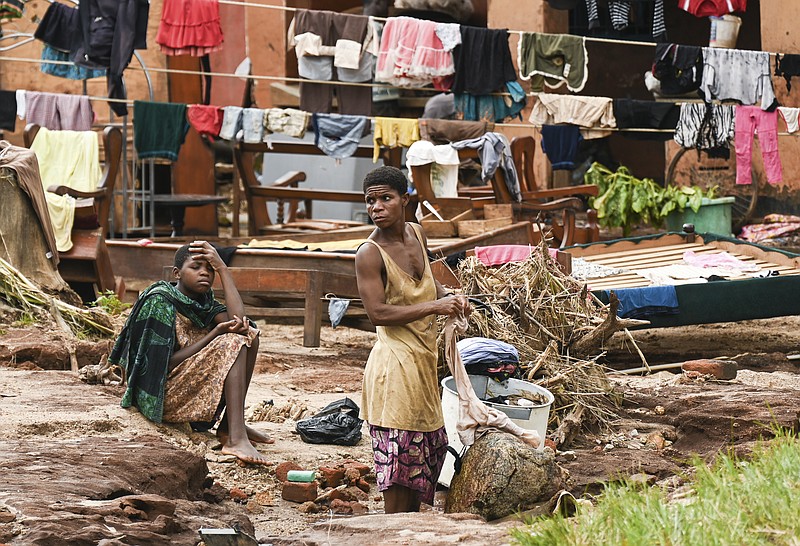 Clothes are hung out to dry on called electrical power lines caused by last week's heavy rains caused by Tropical Cyclone Freddy in Phalombe, southern Malawi Saturday, March 18, 2023. Authorities are still getting to grips with destruction in Malawi and Mozambique with over 370 people confirmed dead and several hundreds still displaced or missing. (AP Photo/Thoko Chikondi)