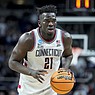 UConn's Adama Sanogo (21) dribbles up the court in the second half of a second-round college basketball game against Saint Mary's in the NCAA Tournament, Sunday, March 19, 2023, in Albany, N.Y. (AP Photo/John Minchillo)