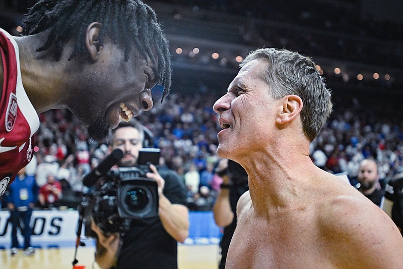 Arkansas forward Kamani Johnson (20) and head coach Eric Musselman cheer, Saturday, March 18, 2023 after the second half of the NCAA Division I Basketball Championship Second Round game at the Wells Fargo Arena in Des Moines, Iowa. Visit nwaonline.com/photos for the photo gallery.
