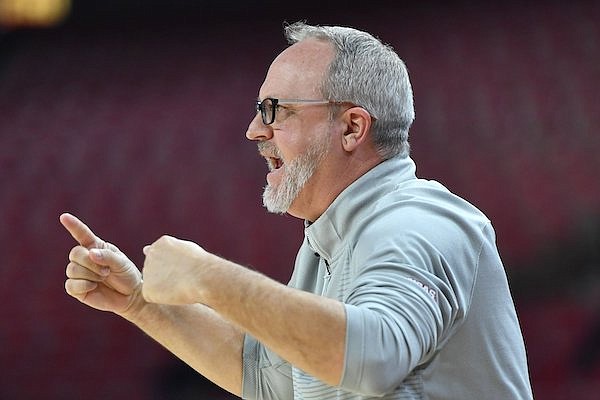 Arkansas coach Mike Neighbors directs his team Monday, March 20, 2023, Stephen F. Austin during the second half of the Razorbacks’ 60-37 win in Bud Walton Arena in Fayetteville.