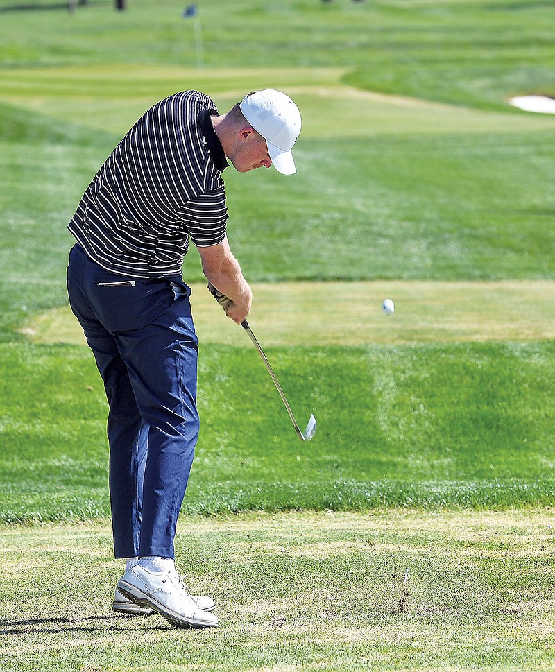 Capital City's Blake Meredith hits a tee shot during last year’s Central Missouri Activities Conference Tournament at Jefferson City Country Club. (Julie Smith/News Tribune)