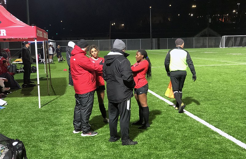 Lady Jays teammates Elicia Theroff and Kyra Madondo talk with Jefferson City assistant coaches Dakota Acock and Rick Hirst during the second half of Tuesday night's match against Father Tolton at Jefferson City High School. (Tom Rackers/News Tribune)