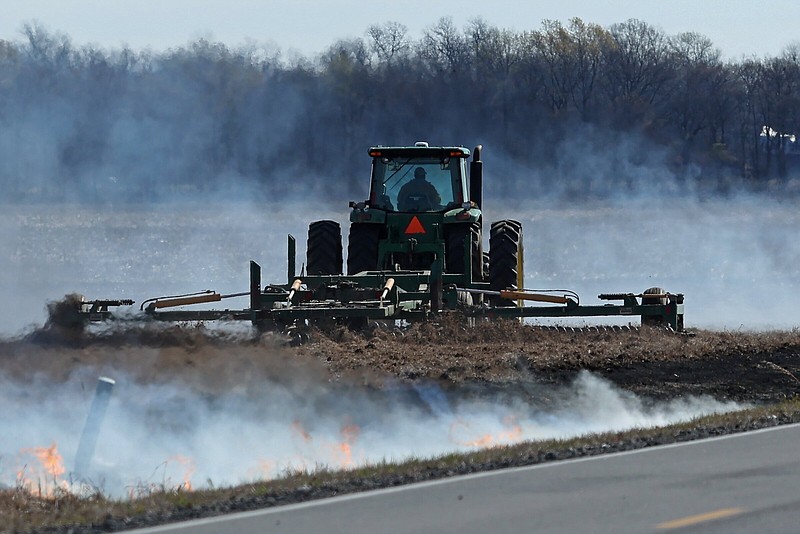 A farmer harrows a field near England on Monday to prepare it for planting.
(Arkansas Democrat-Gazette/Colin Murphey)