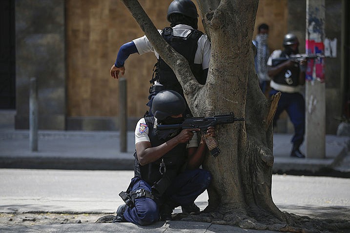 Police officers carry out an anti-gang operation earlier this month in the Lalue neighborhood of Port-au-Prince, Haiti.
(AP/Odelyn Joseph)