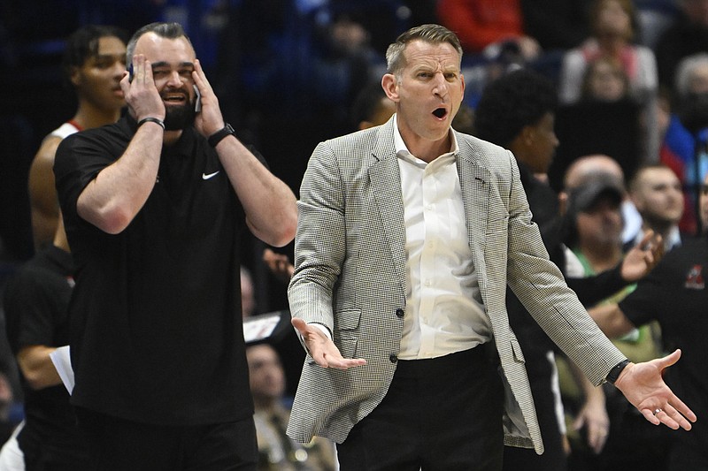 Alabama assistant Bryan Hodgson (left), set to be ASU's 17th head coach in program history, has been an assistant under Coach Nate Oats since 2015 — both at Buffalo and with the Crimson Tide. (AP Photo/John Amis)