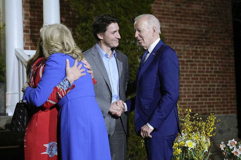 Canadian Prime Minister Justin Trudeau and his wife, Sophie Gregoire Trudeau (left), greet President Joe Biden and first lady Jill Biden on Thursday at Rideau Cottage in Ottawa, Ontario. More photos at arkansasonline.com/324uscanada/.
(AP/Andrew Harnik)