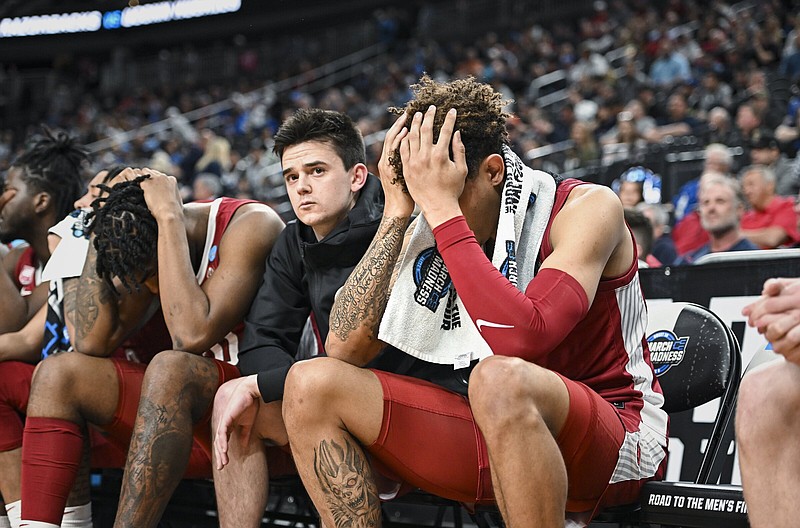 Arkansas players react during the second half of an NCAA Men’s Tournament West Regional semifinal against Connecticut on Thursday at T-Mobile Arena in Las Vegas. The Razorbacks lost 88-65 to end their season. More photos at arkansasonline.com/324uauconn/
(NWA Democrat-Gazette/Charlie Kaijo)