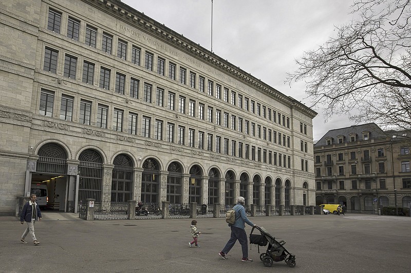 People walk past the Swiss National Bank in Zurich, Switzerland, on Thursday.
(AP/Keystone/Michael Buholzer)