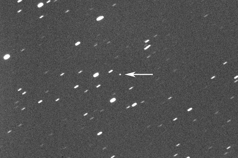 Asteroid 2023 DZ2 (indicated by arrow at center) is seen about 1.1 million miles away from the Earth on Wednesday.
(AP/Virtual Telescope Project/Gianluca Masi)