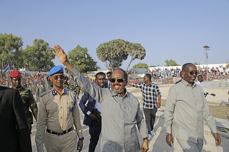 FILE - Somalia President Hassan Sheikh Mohamud leads a demonstration at Banadir stadium, Mogadishu, Thursday Jan. 12, 2023. The government rally encouraged an uprising against the al-Shabab group amid a month-long military offensive. The African Union appealed for nearly $90 million Wednesday, March 22, 2023, for its peacekeeping force in Somalia, which is providing support to its military forces battling al-Shabab extremists. (AP Photo/Farah Abdi Warsameh, File)