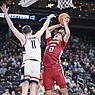Arkansas guard Anthony Black (0) goes up for a shot against Connecticut forward Alex Karaban (11) during an NCAA Tournament game Thursday, March 23, 2023, in Las Vegas.