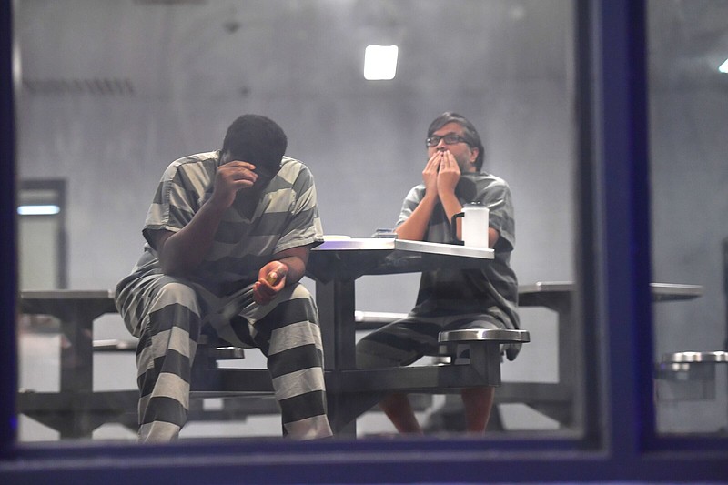 Detainees sit in chairs during a tour of the Washington County Detention Center in Fayetteville on Nov. 23.
(NWA Democrat-Gazette/Andy Shupe)