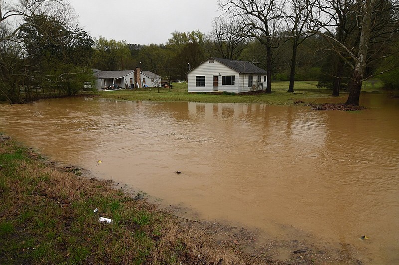 Flooding occurred Friday along MacArthur Drive in North Little Rock after storms passed through the area.
(Arkansas Democrat-Gazette/Staci Vandagriff)