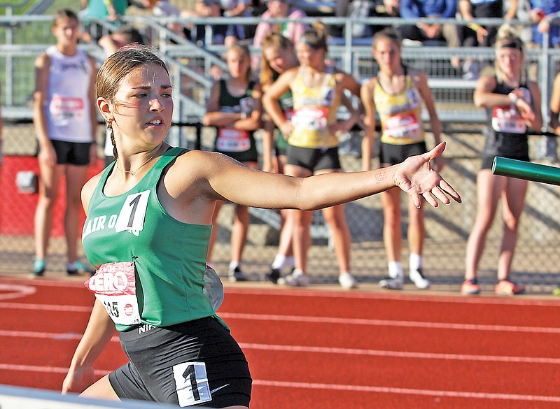 Taylor Yoder of Blair Oaks reaches for the baton during an exchange in the girls 4x400-meter relay preliminaries in last year’s Class 3 track and field state championships at Adkins Stadium. (Greg Jackson/News Tribune)