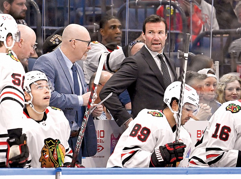 Blackhawks coach Luke Richardson (top right) looks on during the third period of a game earlier this month against the Lightning in Tampa, Fla. (Associated Press)