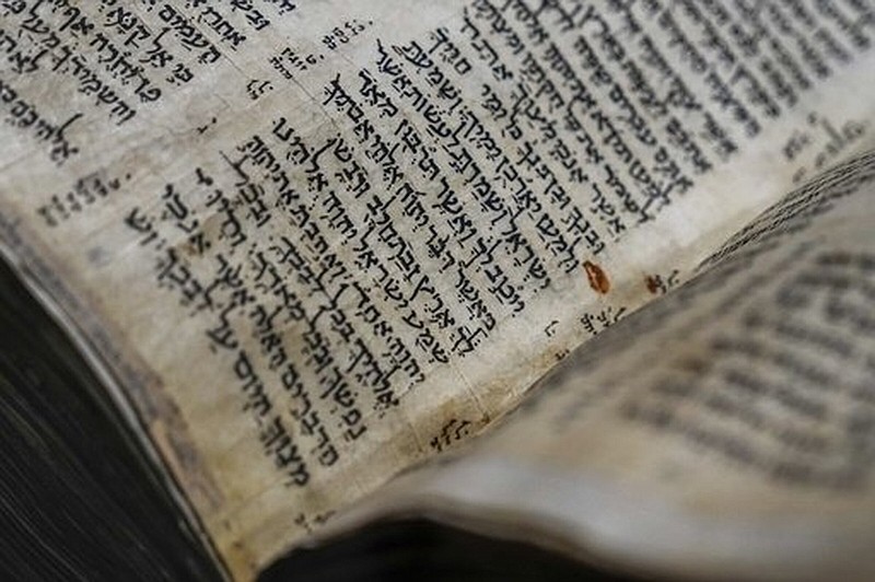 The Codex Sassoon, a 1,100-year-old Hebrew Bible, was on display Wednesday at Tel Aviv’s ANU Museum of the Jewish People for a weeklong exhibition of the manuscript. The exhibition is part of a whirlwind worldwide tour of the artifact in the United Kingdom, Israel and the United States before its expected sale for $30 million to $50 million. The codex is one of the oldest surviving biblical manuscripts.
(AP/Ariel Schalit)