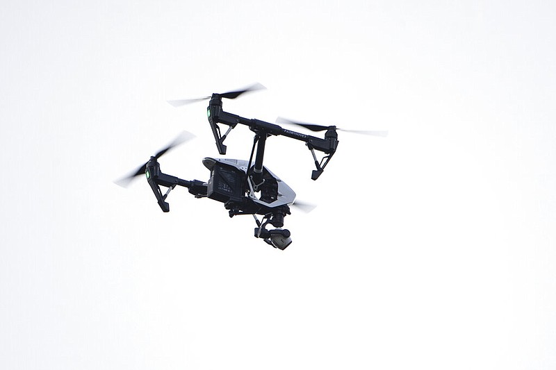 A drone operated by a police investigator flies over the scene of a small plane crash in a residential neighborhood in Pennsylvania in this August 2019 file photo. (AP/Matt Rourke)
