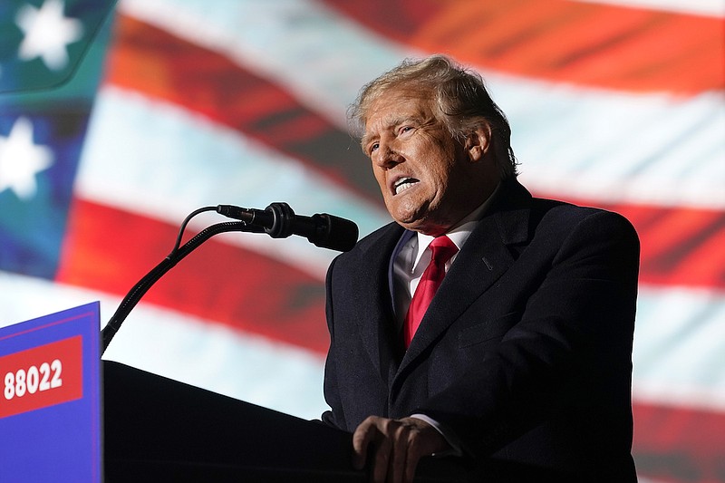 Former President Donald Trump speaks at a campaign rally in support of the campaign of Ohio Senate candidate JD Vance at Wright Bros. Aero Inc. at Dayton International Airport, Nov. 7, 2022, in Vandalia, Ohio. On Friday, March 24, 2023 The Associated Press reported on stories circulating online incorrectly claiming it is a double standard that Trump may be indicted over alleged hush money payments to women who accused him of sexual encounters, while former President Bill Clinton faced no criminal charges for paying a sexual harassment accuser $850,000. (AP Photo/Michael Conroy, File)