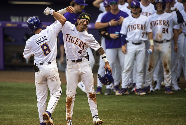 LSU's Gavin Dugas (8) celebrates after his home run with Jordan Thompson (4) in the bottom of the second inning of the first NCAA college baseball game of a doubleheader against Arkansas, Saturday, March 25, 2023, in Baton Rouge, La. (Michael Jouhnsom/The Advocate via AP)