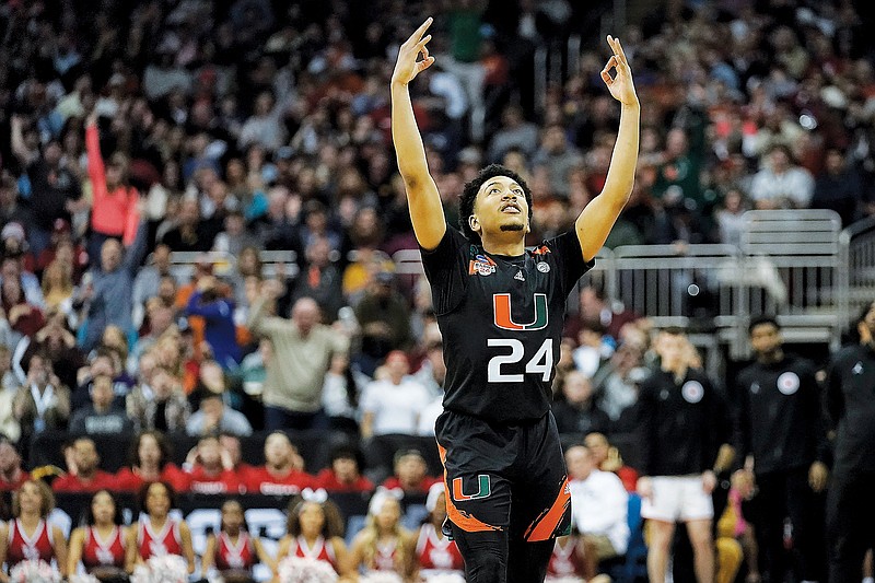 Miami guard Nijel Pack celebrates after scoring in Friday's Midwest Regional semifinal game against Houston in the NCAA Tournament in Kansas City. (Associated Press)