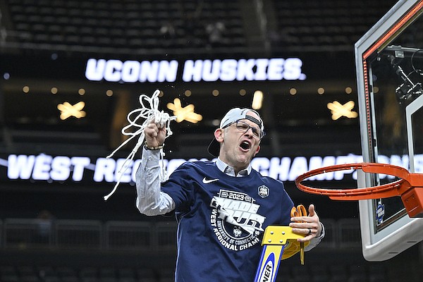 UConn head coach Dan Hurley celebrates after cutting down the netting from the 82-54 win against Gonzaga of an Elite 8 college basketball game in the West Region final of the NCAA Tournament, Saturday, March 25, 2023, in Las Vegas. (AP Photo/David Becker)