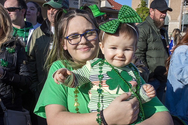 Nevaeh Rowe holding Isla Lafleur on 03/17/2023 at the First-Ever 20h Annual Worlds Shortest St Patrick's Day Parade in Hot Springs.
(Arkansas Democrat-Gazette/Cary Jenkins)