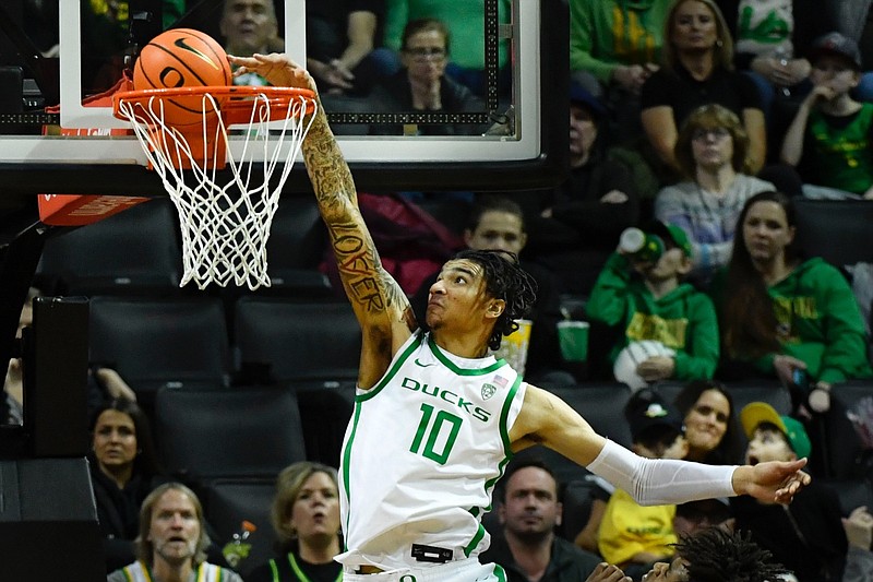 Oregon center Kel'el Ware (10) tries to score against Oregon State during the second half of an NCAA college basketball game Saturday, Dec. 31, 2022, in Eugene, Ore. (AP Photo/Andy Nelson)