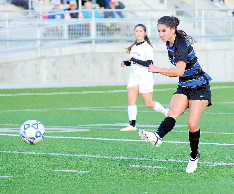 Capital City's Georgia Pardalos scores the Lady Cavaliers' third goal in the first half of Monday night’s game against Warrenton at Capital City High School. (Shaun Zimmerman/News Tribune)