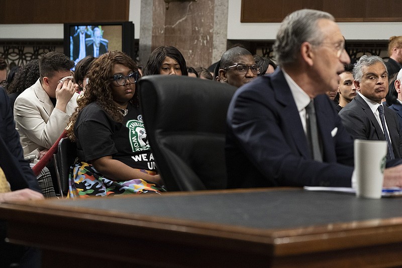 Sam Amato (left) of Buffalo, N.Y., who is a union member and was illegally fired from Starbucks after 13 years, cries Wednesday during testimony by former Starbucks Chief Executive Officer Howard Schultz, before the Senate Health, Education, Labor and Pensions Committee.
(AP/Jacquelyn Martin)