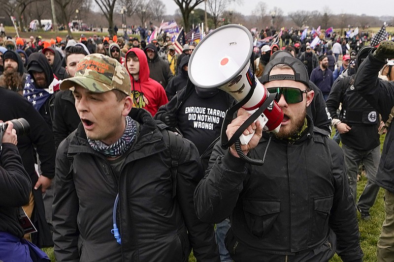 FILE - Proud Boys members Zachary Rehl, left, and Ethan Nordean, walk toward the U.S. Capitol in Washington, in support of President Donald Trump, Jan. 6, 2021. (AP Photo/Carolyn Kaster, File)