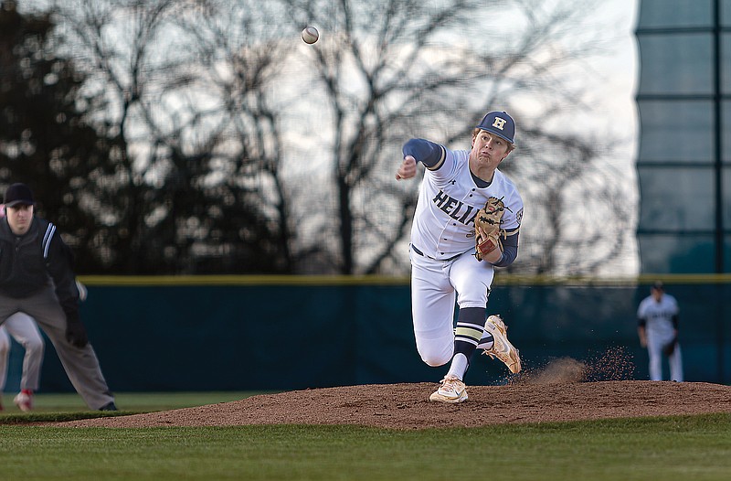 Helias pitcher Sam Wyrick throws to the plate during Tuesday’s game against Ozark at the American Legion Post 5 Sports Complex. (Josh Cobb/News Tribune)