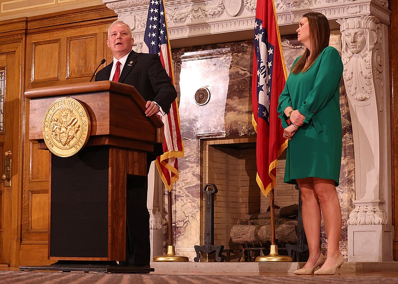 Attorney General Tim Griffin, left, addresses members of the media during a press conference at the Arkansas state Capitol alongside Gov. Sarah Huckabee Sanders on Tuesday, March 28, 2023 announcing plans to sue Facebook and Tiktok's parent companies Meta and Bytedance respectively. (Arkansas Democrat-Gazette/Colin Murphey)
