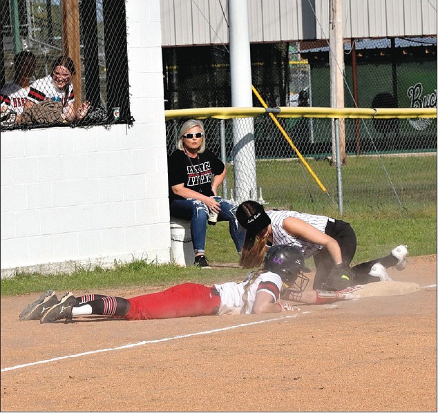 Play at third: Smackover's Julia James puts a tag on a Hermitage runner trying to get back to third base during their game Monday in Smackover. The Lady Bucks won 19-4. Smackover hosted Pine Bluff Dollarway on Tuesday. (Penny Chanler/Special to the News-Times)